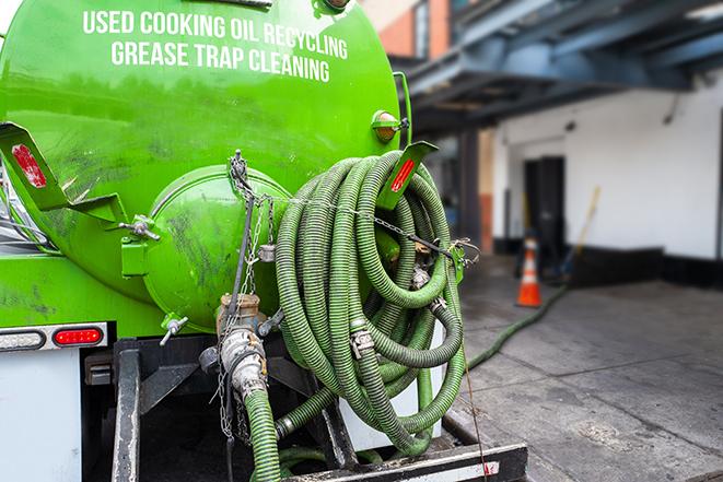 pump truck removing waste from a grease trap in Pecatonica
